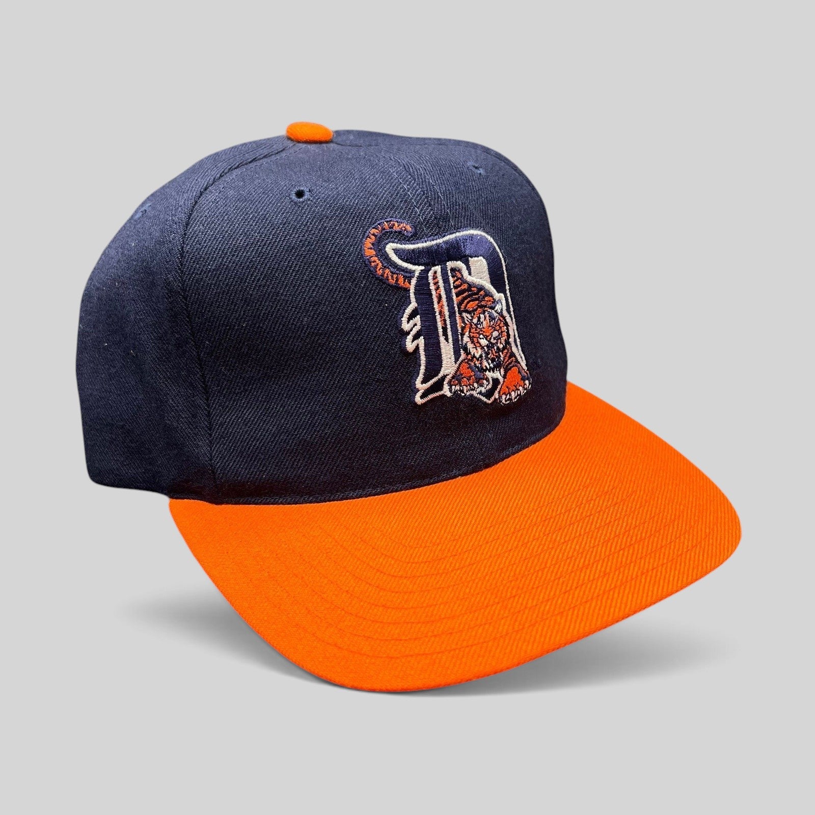 Raree Finds vintage American Needle Detroit Tigers wool snapback hat with navy crown, orange brim, and tiger logo.