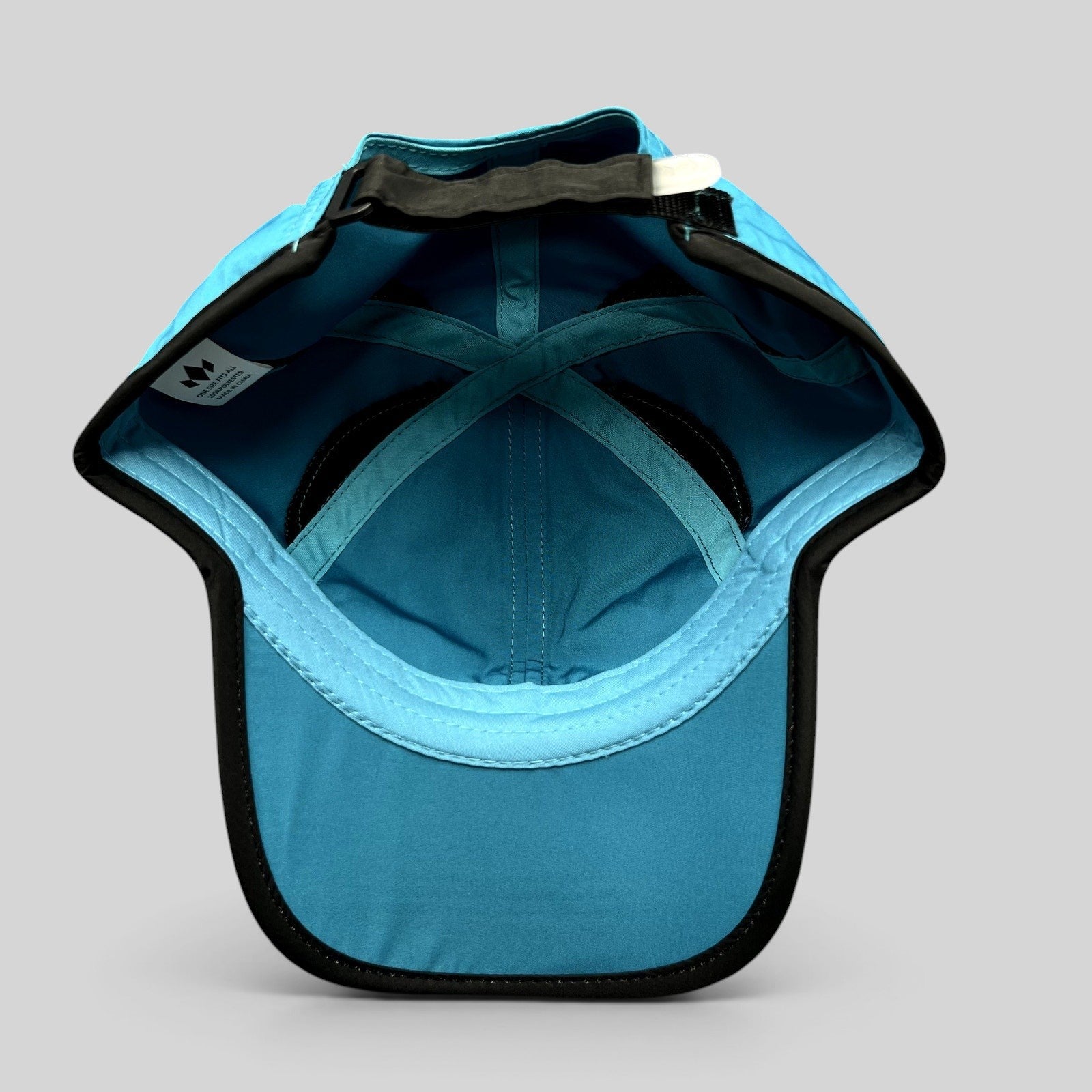 Raree Finds Diadem blue lightweight polyester performance running hat with black trim and adjustable strapback interior