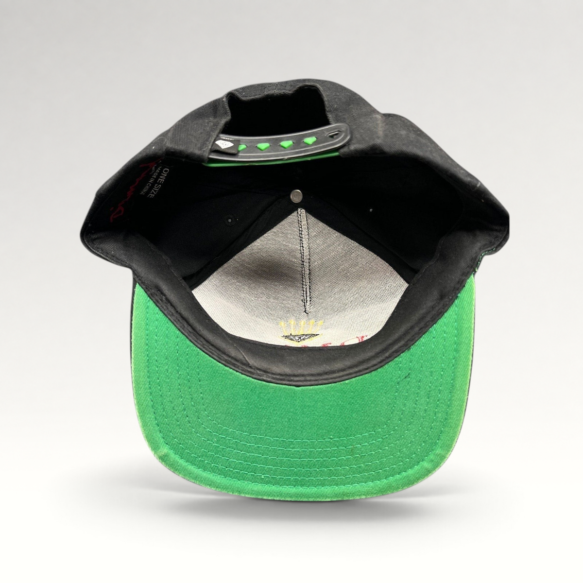 Raree Finds vintage Diamond Supply Co. black snapback hat with green underbrim and interior crown logo embroidery