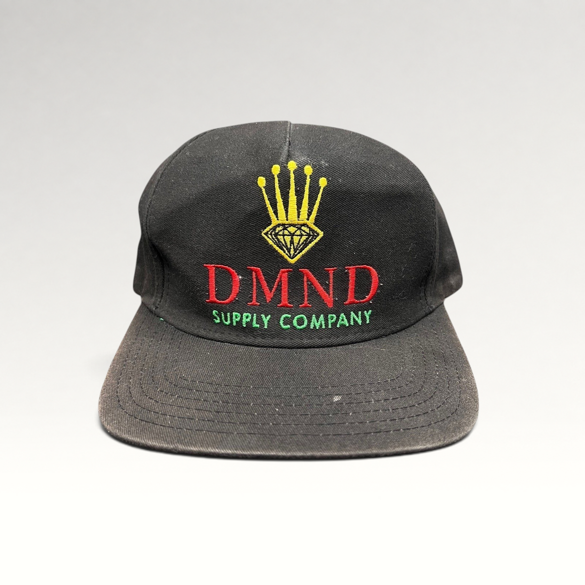 Raree Finds vintage Diamond Supply Co. black snapback hat with red, yellow, and green crown and diamond embroidery.