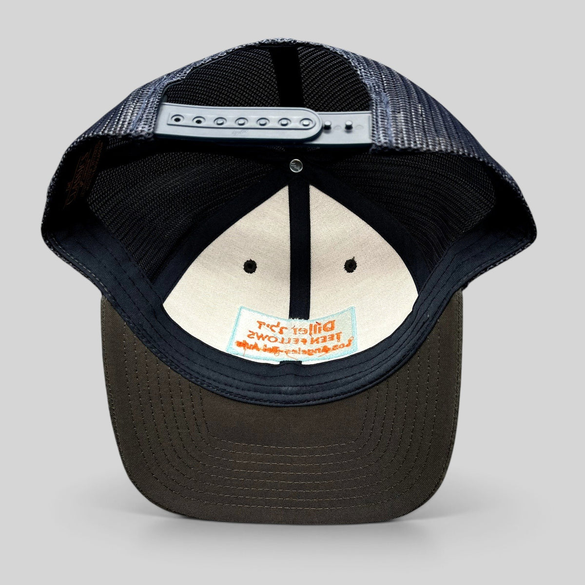 Raree Finds Diller Teen Fellows Yupoong Classics trucker hat interior view showing branding and navy mesh back