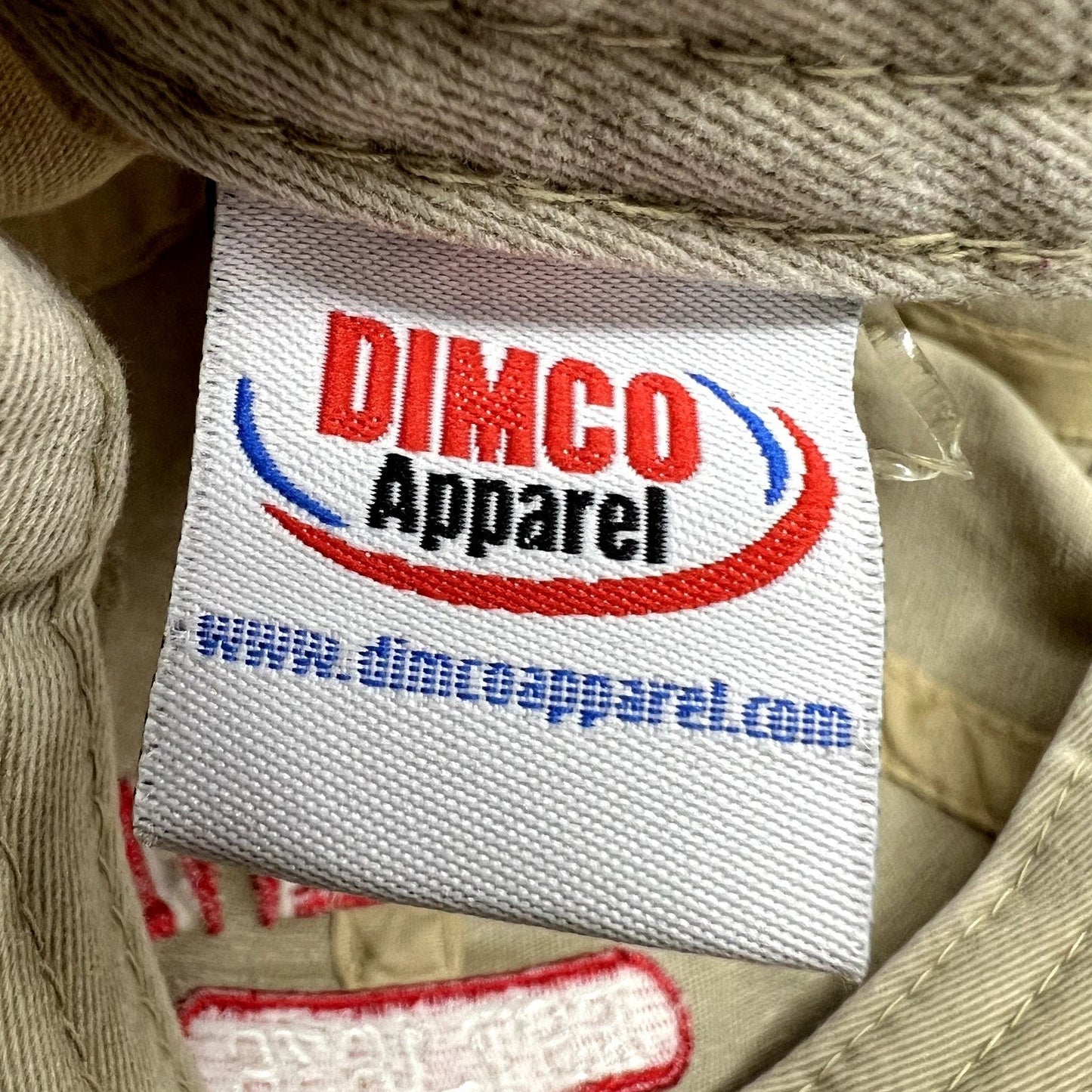 Raree Finds vintage khaki cotton hat interior label featuring the Dimco Apparel logo in red and blue embroidery