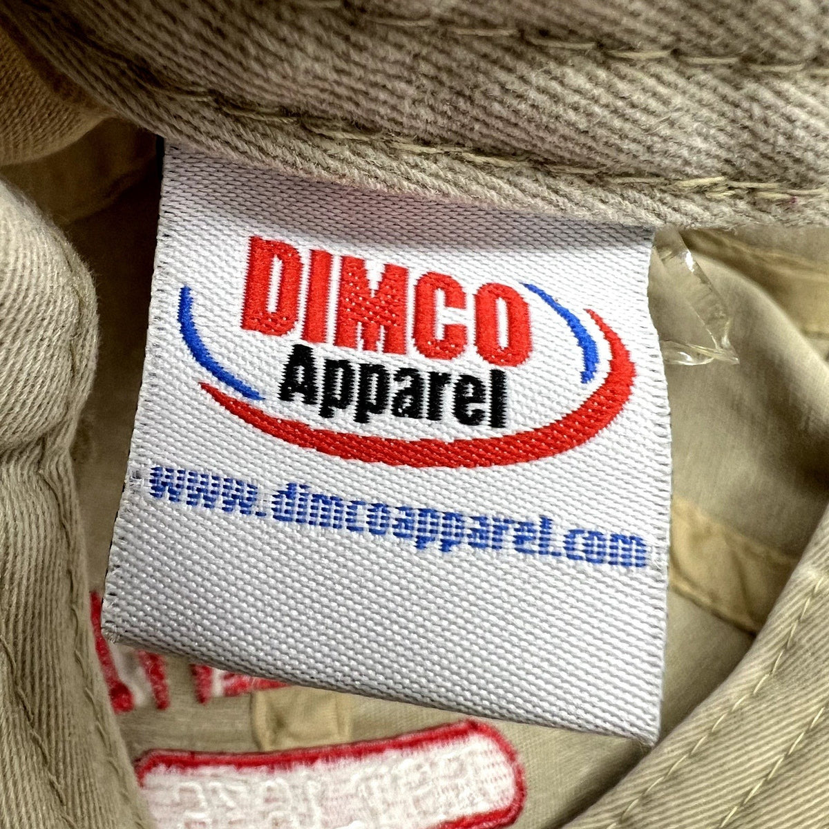 Raree Finds vintage khaki cotton hat interior label featuring the Dimco Apparel logo in red and blue embroidery