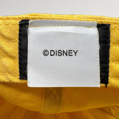 Raree Finds Disney VoluntEARS hat interior tag with white fabric and black Disney branding on a yellow cotton crown