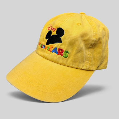 Raree Finds Disney VoluntEARS yellow cotton strapback hat with Mickey Mouse silhouette and colorful embroidery.
