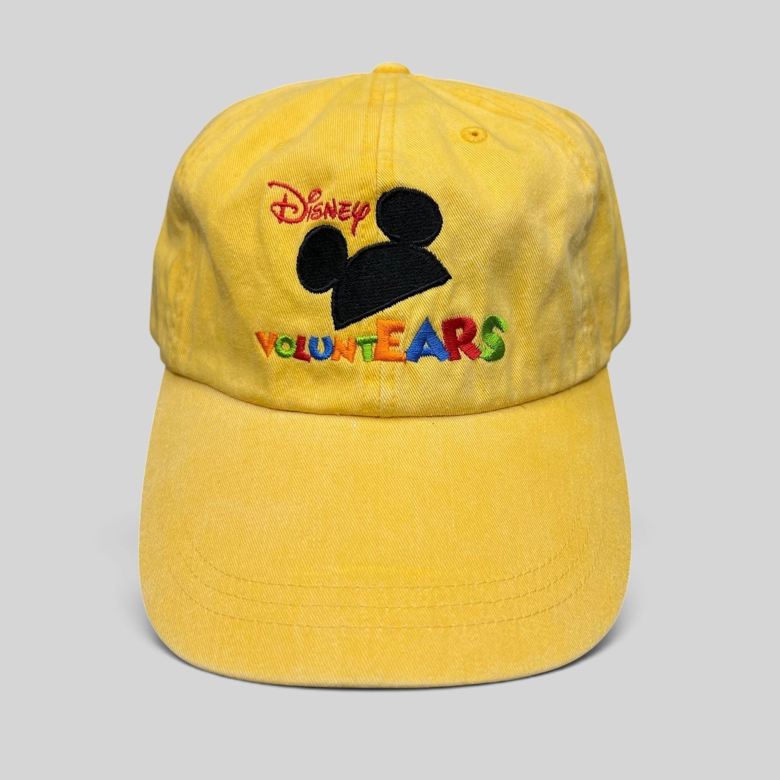 Raree Finds Disney VoluntEARS yellow cotton strapback hat with embroidered Mickey silhouette and colorful logo