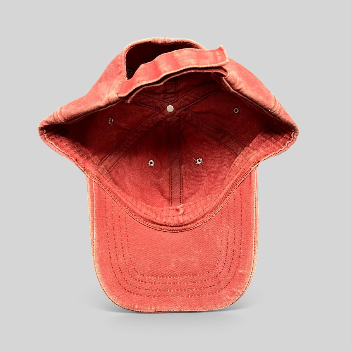 Raree Finds distressed red washed cotton dad cap interior view showing adjustable strapback and stitched construction