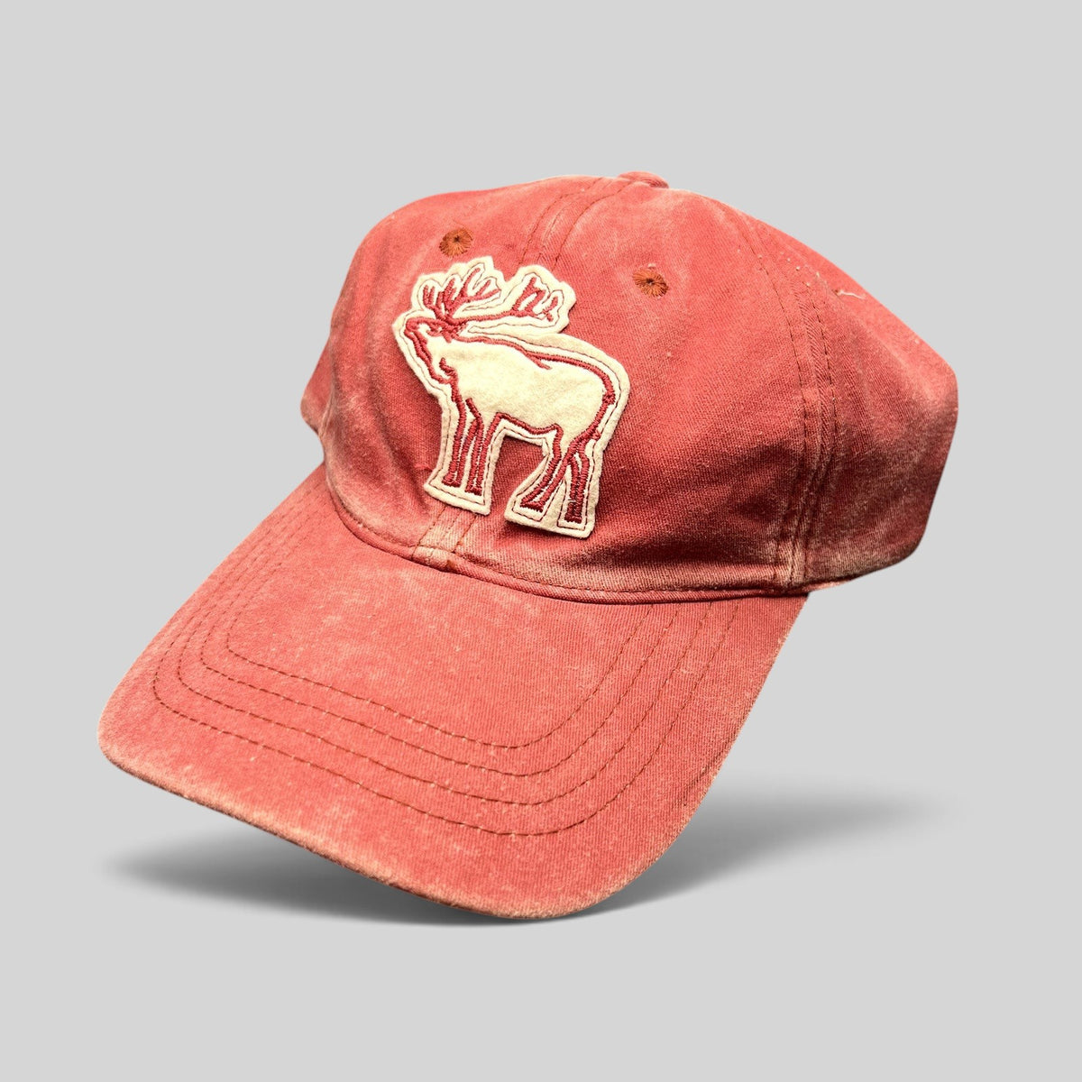 Raree Finds distressed red washed cotton dad cap with a vintage embroidered elk deer applique on the front