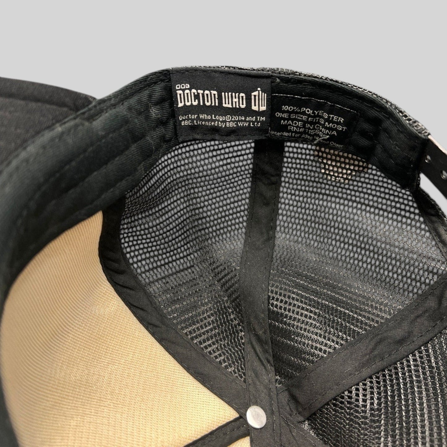 Raree Finds Doctor Who trucker hat interior showing the official BBC woven brand label and black mesh lining