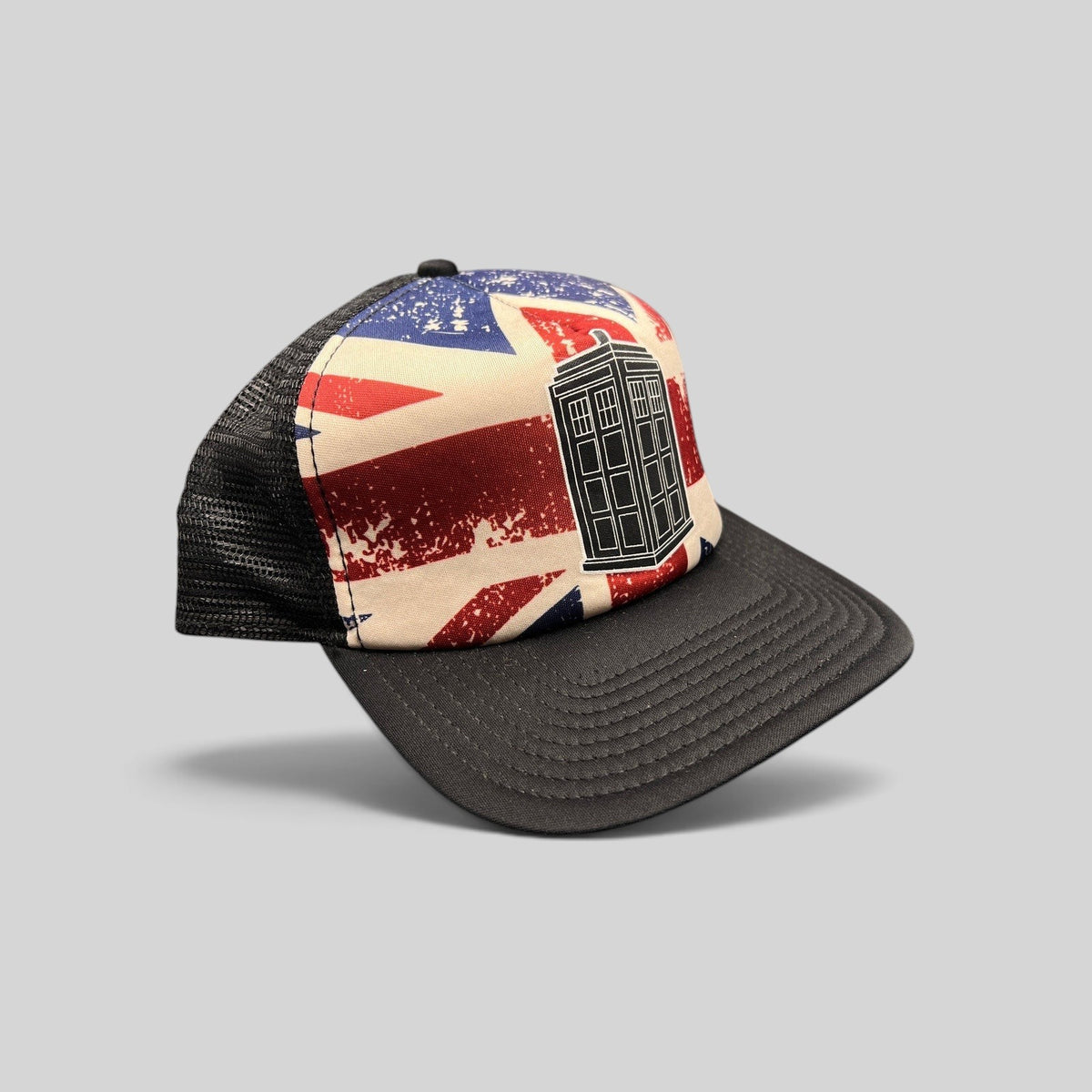 Raree Finds Doctor Who TARDIS trucker hat with a distressed Union Jack front panel, black bill, and mesh back.