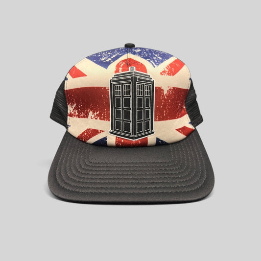 Raree Finds Doctor Who trucker hat featuring a TARDIS graphic on a distressed Union Jack print with black mesh back.