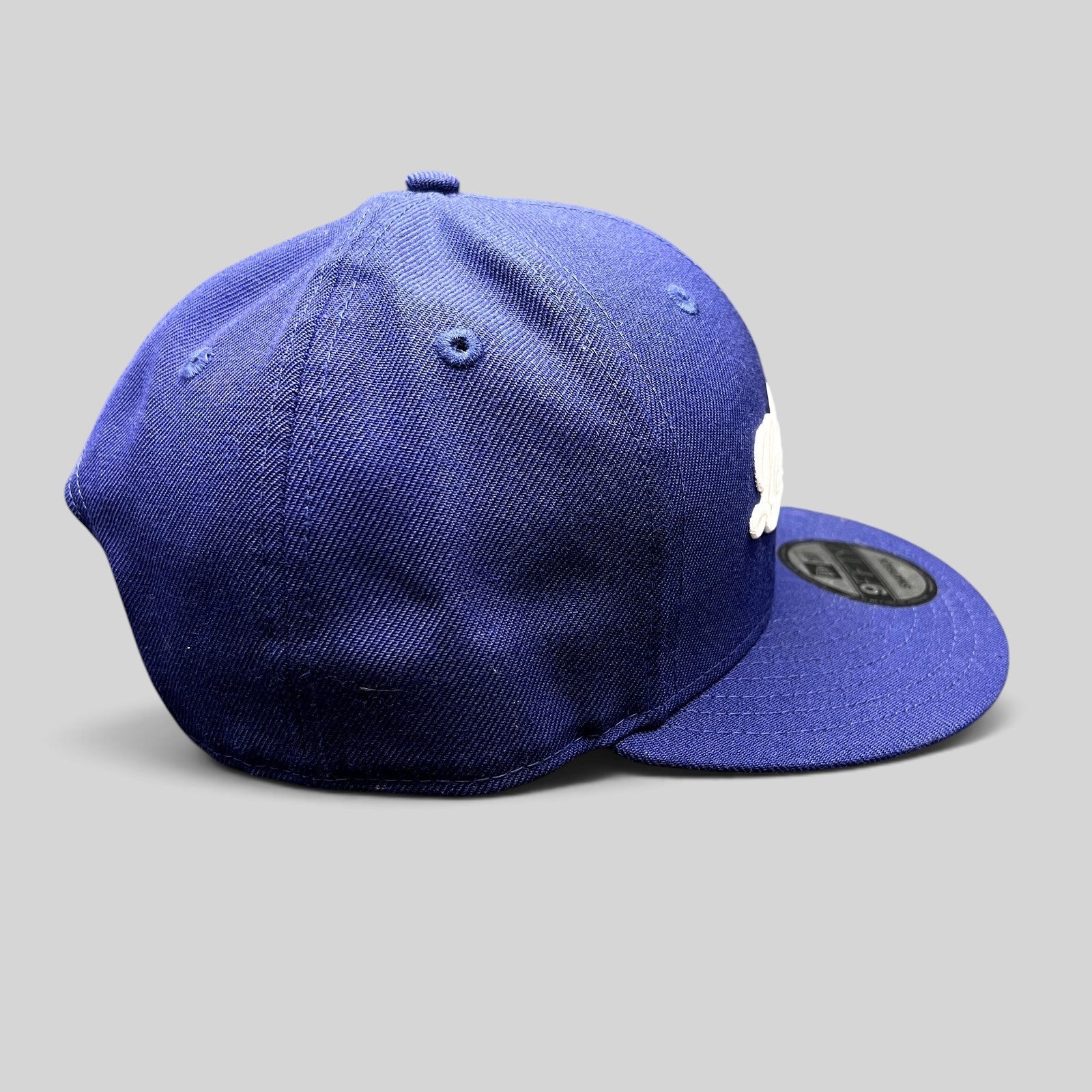 Raree Finds Los Angeles Dodgers royal blue New Era 9FIFTY snapback hat with white script logo and flat visor