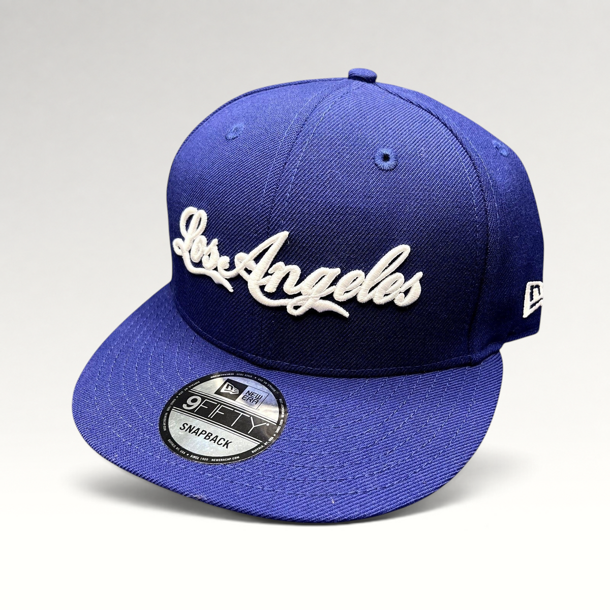 Raree Finds Los Angeles Dodgers royal blue 9FIFTY snapback hat with white raised script embroidery and flat visor.