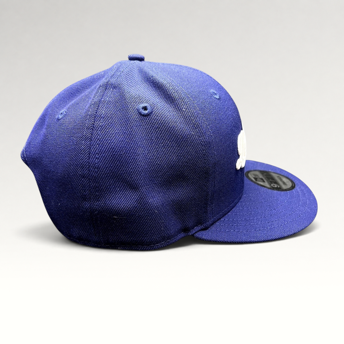 Raree Finds Los Angeles Dodgers royal blue New Era 9FIFTY snapback hat with white script logo and flat visor