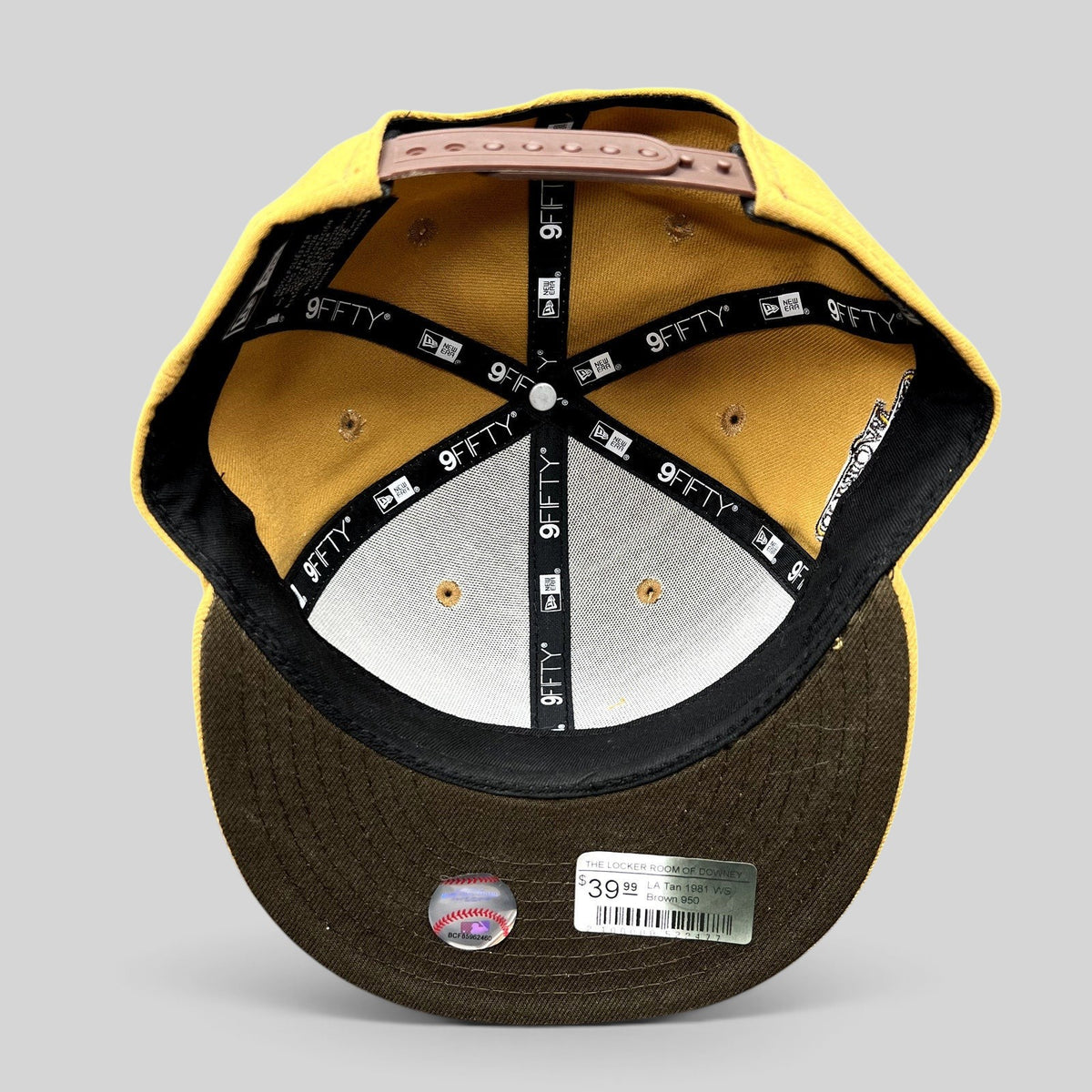 Raree Finds New Era LA Dodgers 9FIFTY snapback interior showing tan crown, brown brim, and branded taping.