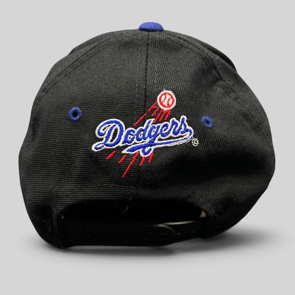 Raree Finds vintage 90s Los Angeles Dodgers snapback hat with embroidered team logo and baseball trail on the back
