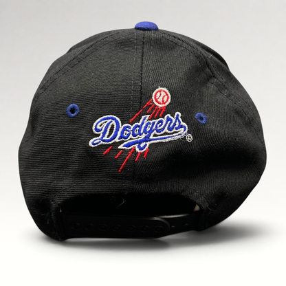 Raree Finds vintage 90s Los Angeles Dodgers snapback hat with embroidered team logo and baseball trail on the back