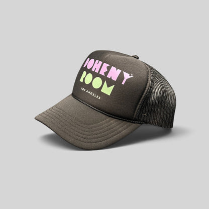 Raree Finds black Otto trucker hat with Doheny Room pastel logo, structured foam front, and breathable mesh back.