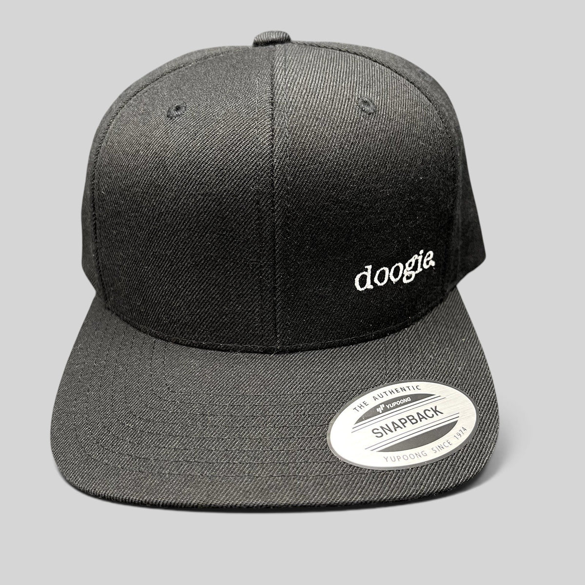 Raree Finds black Doogie Kamealoha M.D. snapback hat with embroidered white doogie logo on front