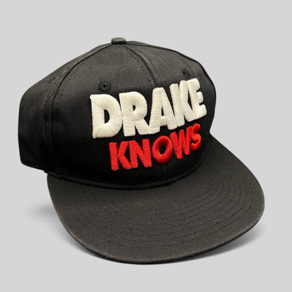 Raree Finds vintage black snapback hat with 3D white and red Drake Knows embroidery in a streetwear style
