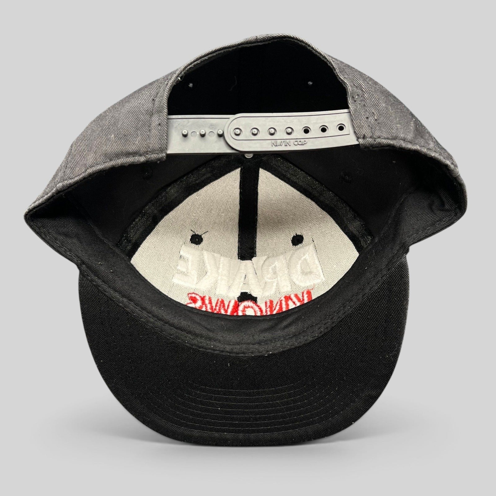 Raree Finds vintage black snapback hat with 3D embroidered Drake Knows text in white and red, rear view.