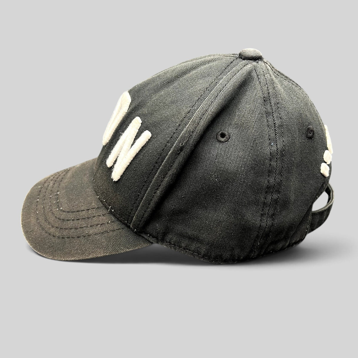 Raree Finds black DSQUARED2 ICON strapback hat with raised white embroidery and a curved brim in designer streetwear.