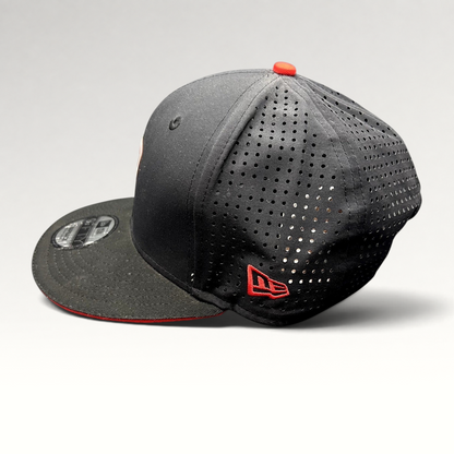 Raree Finds black New Era 9FIFTY Ducati snapback hat with laser-perforated side panels and red embroidered logo detail.