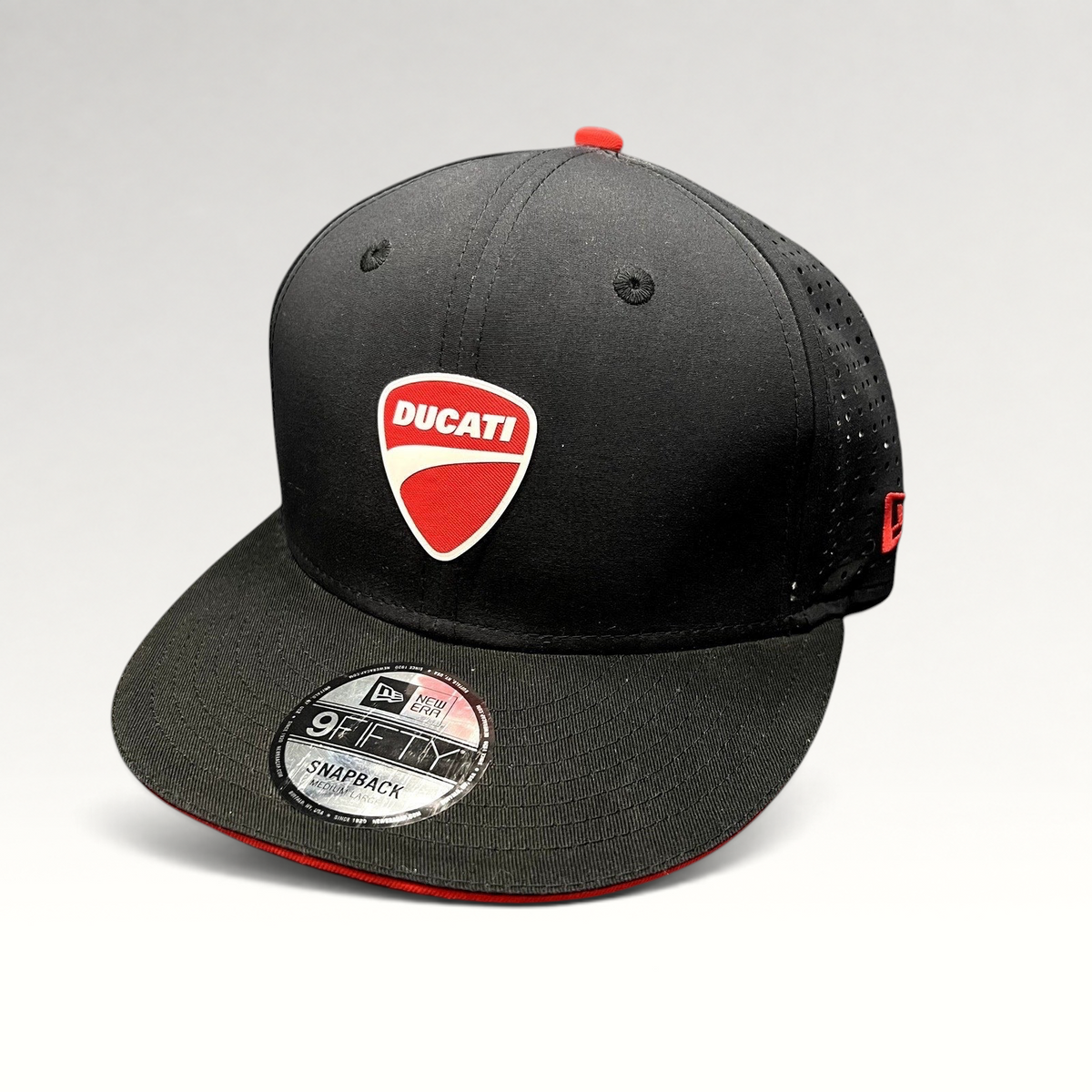 Raree Finds black New Era 9FIFTY Ducati snapback hat with a red shield patch and laser-perforated rear panels.