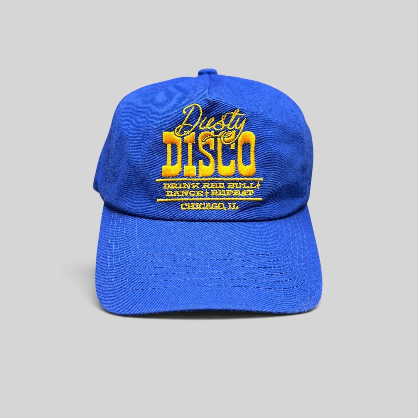 Raree Finds vintage royal blue snapback hat with yellow Dusty Disco Chicago embroidery and adjustable back closure.