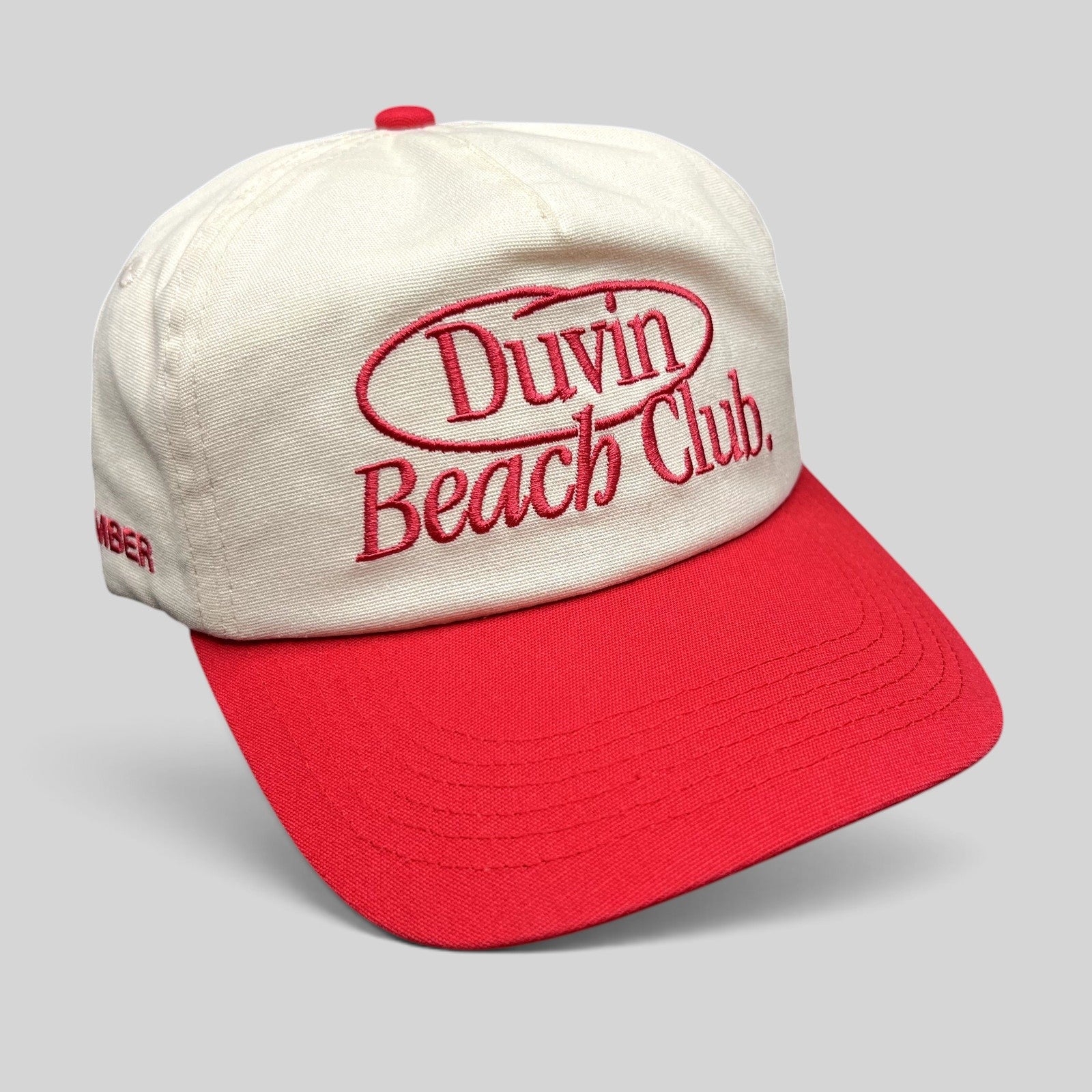 Raree Finds Duvin Beach Club snapback hat in cream and red cotton with embroidered vintage script logo on front