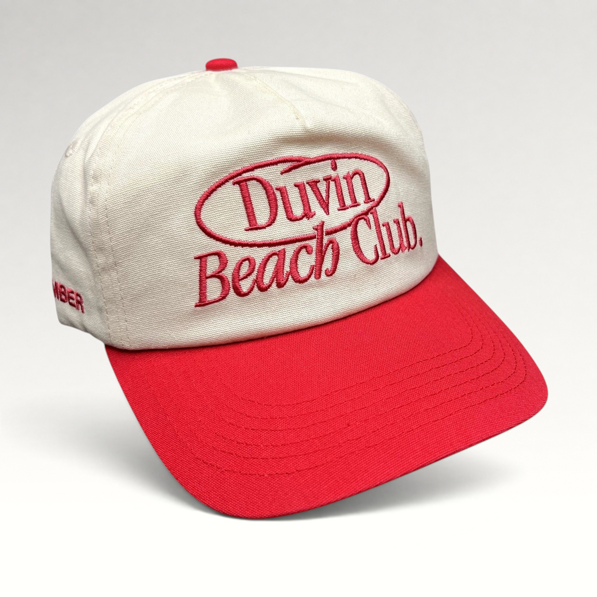 Raree Finds Duvin Beach Club snapback hat in cream and red cotton with embroidered vintage script logo on front