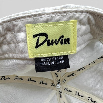 Raree Finds Duvin Beach Club hat interior showing yellow brand label and 100% cotton tag on white fabric