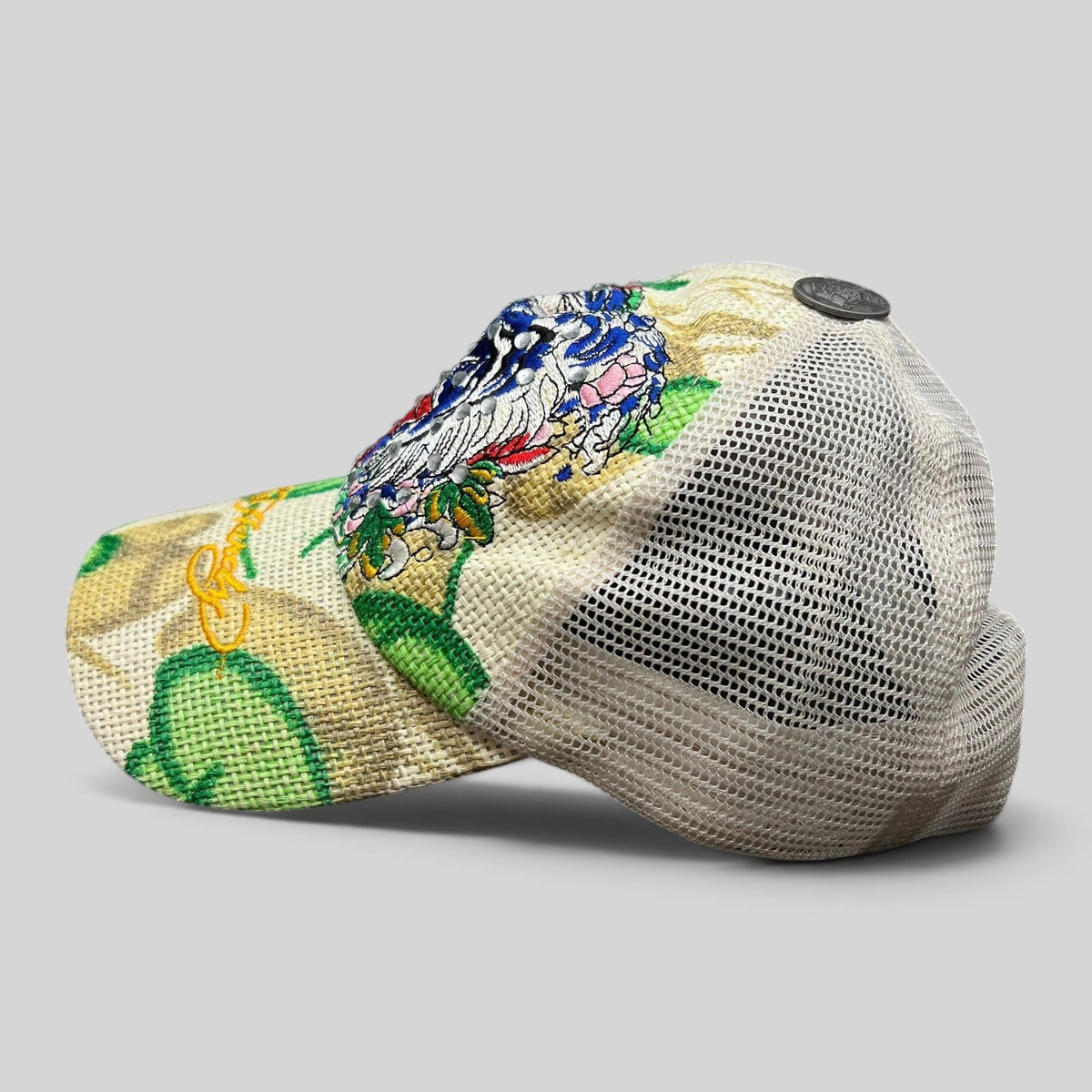 Raree Finds vintage Don Ed Hardy Y2K trucker hat with embroidered tiger graphic, rhinestone details, and mesh back.