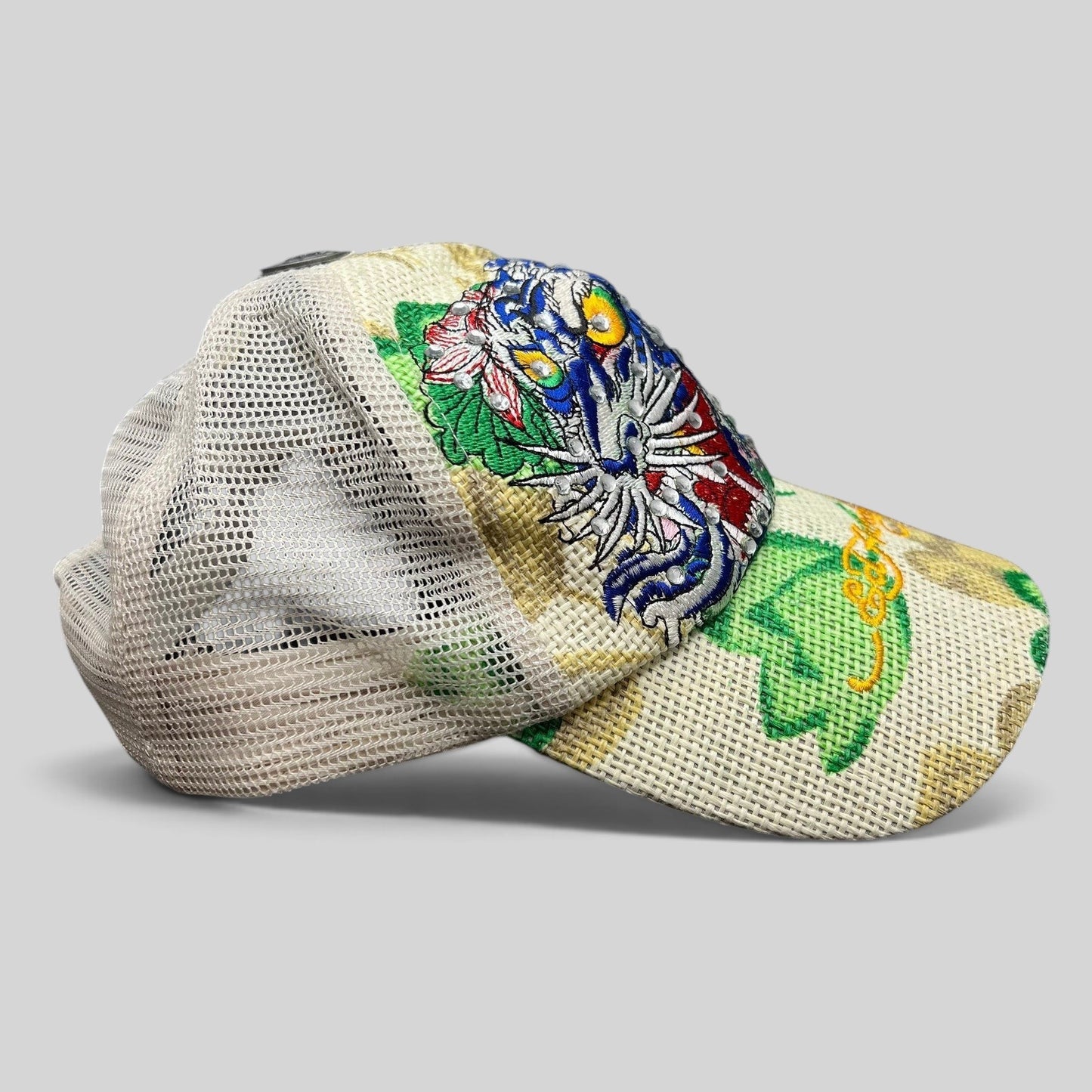 Raree Finds vintage Ed Hardy trucker hat with embroidered tiger graphic, rhinestone details, and white mesh back.