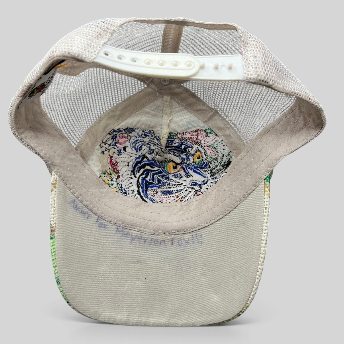 Raree Finds vintage Don Ed Hardy Y2K trucker hat with white mesh back and embroidered tiger graphic on brim underside