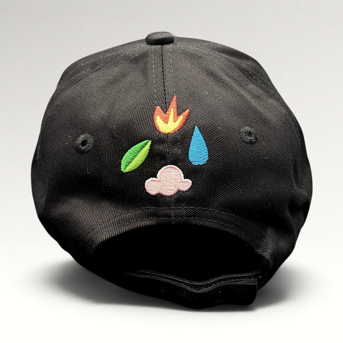 Raree Finds black strapback hat featuring colorful elemental icon embroidery on the back panel