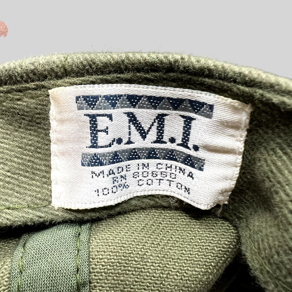 Raree Finds vintage EMI brand tag inside an olive green cotton hat from the Grand Canyon Squire Inn