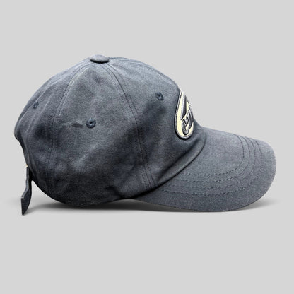 Raree Finds navy EMIS cotton strapback hat with a cream minimalist logo embroidery and curved brim