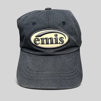 Raree Finds navy cotton strapback hat by EMIS featuring a cream oval logo embroidery on the front
