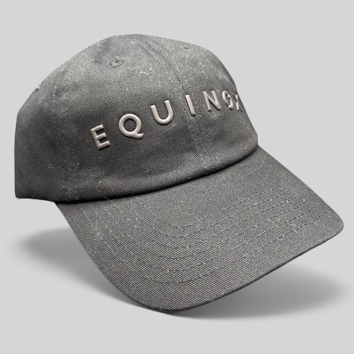 Raree Finds black Equinox fitness strapback hat with raised rubberized logo lettering and adjustable fabric strap