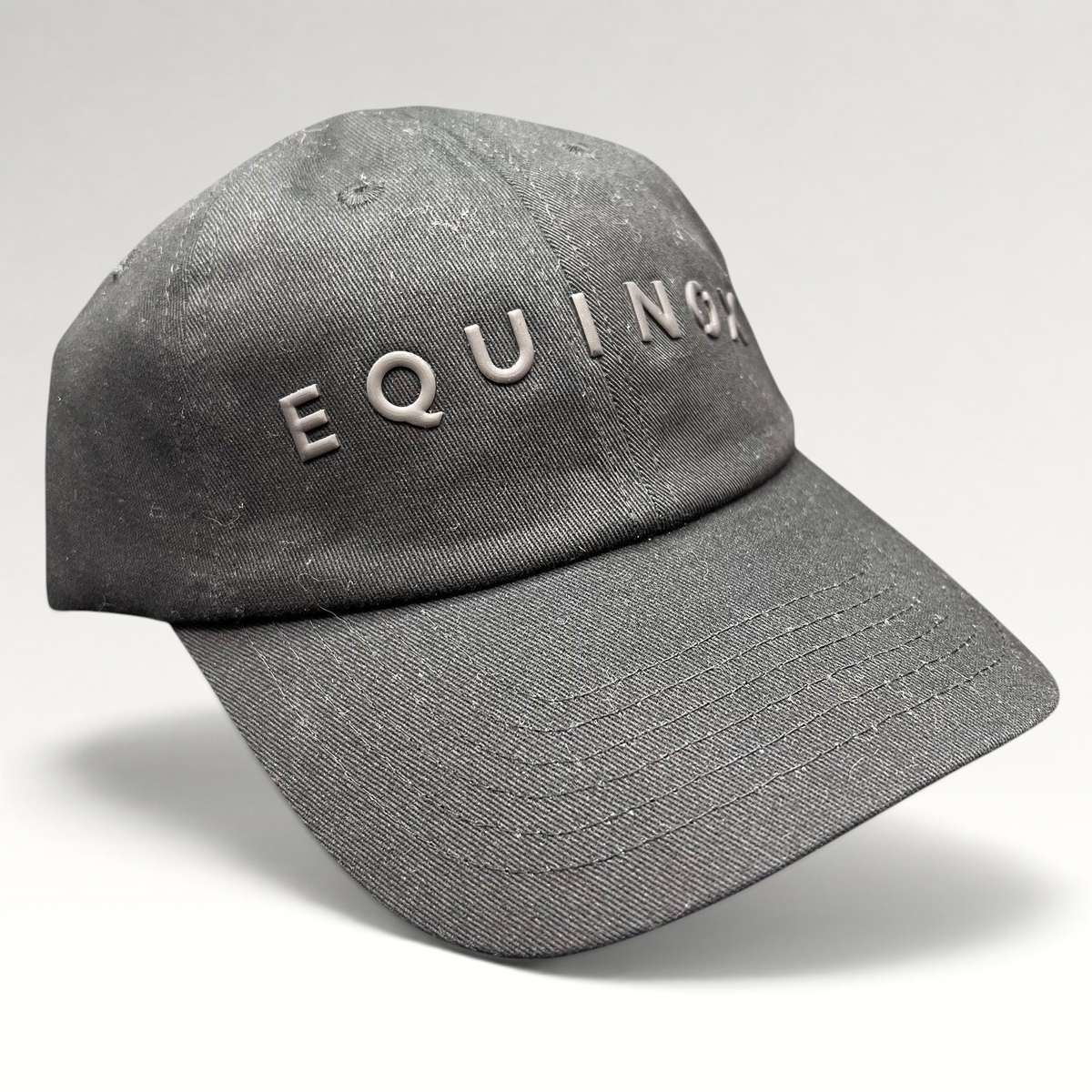 Raree Finds black Equinox fitness strapback hat with raised rubberized logo lettering and adjustable fabric strap