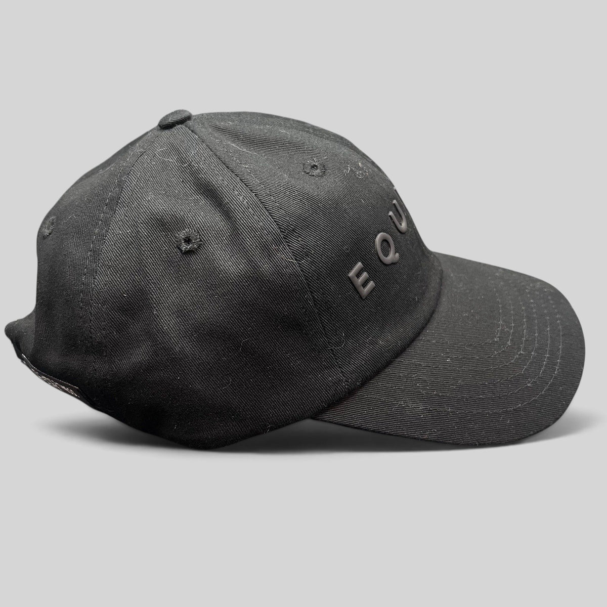 Raree Finds black Equinox fitness strapback hat with raised tonal rubber lettering and adjustable metal buckle closure