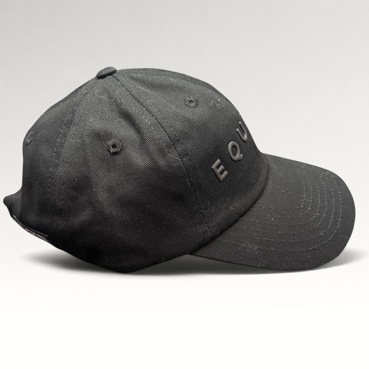 Raree Finds black Equinox fitness strapback hat with raised tonal rubber lettering and adjustable metal buckle closure