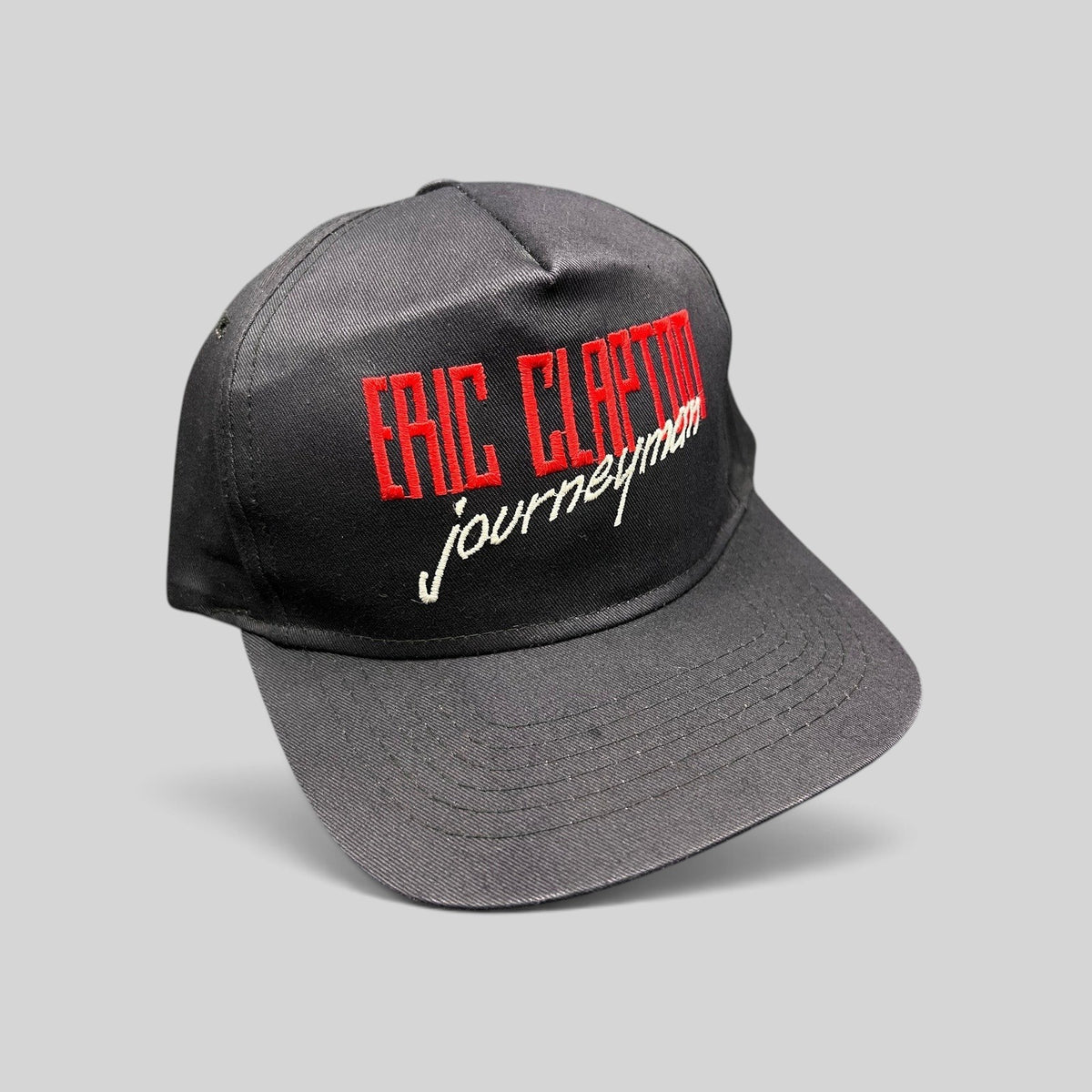 Raree Finds vintage 1989 Eric Clapton Journeyman tour snapback hat in black twill with red and white embroidery.