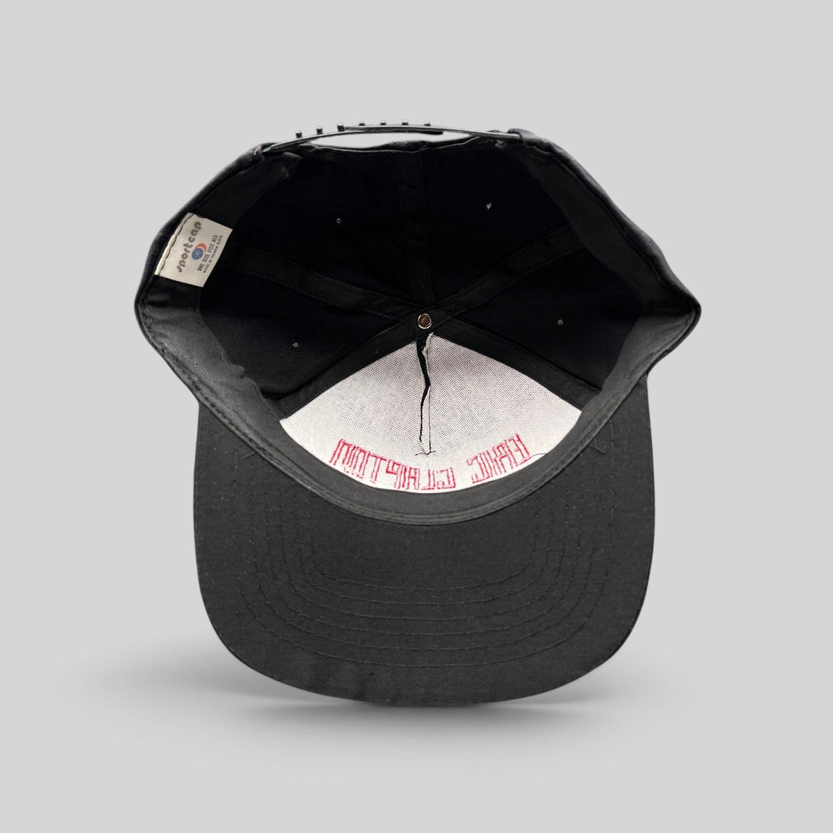 Raree Finds vintage 1989 Eric Clapton Journeyman tour hat interior showing Sportcap label and red embroidery detail