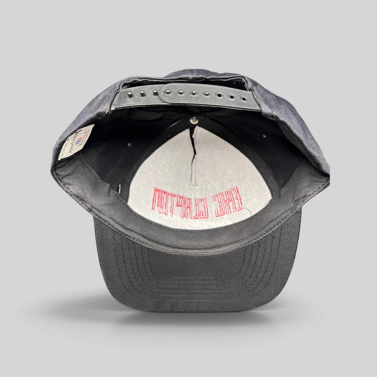 Raree Finds vintage 1989 Eric Clapton Journeyman tour snapback hat showing interior black twill and red embroidery