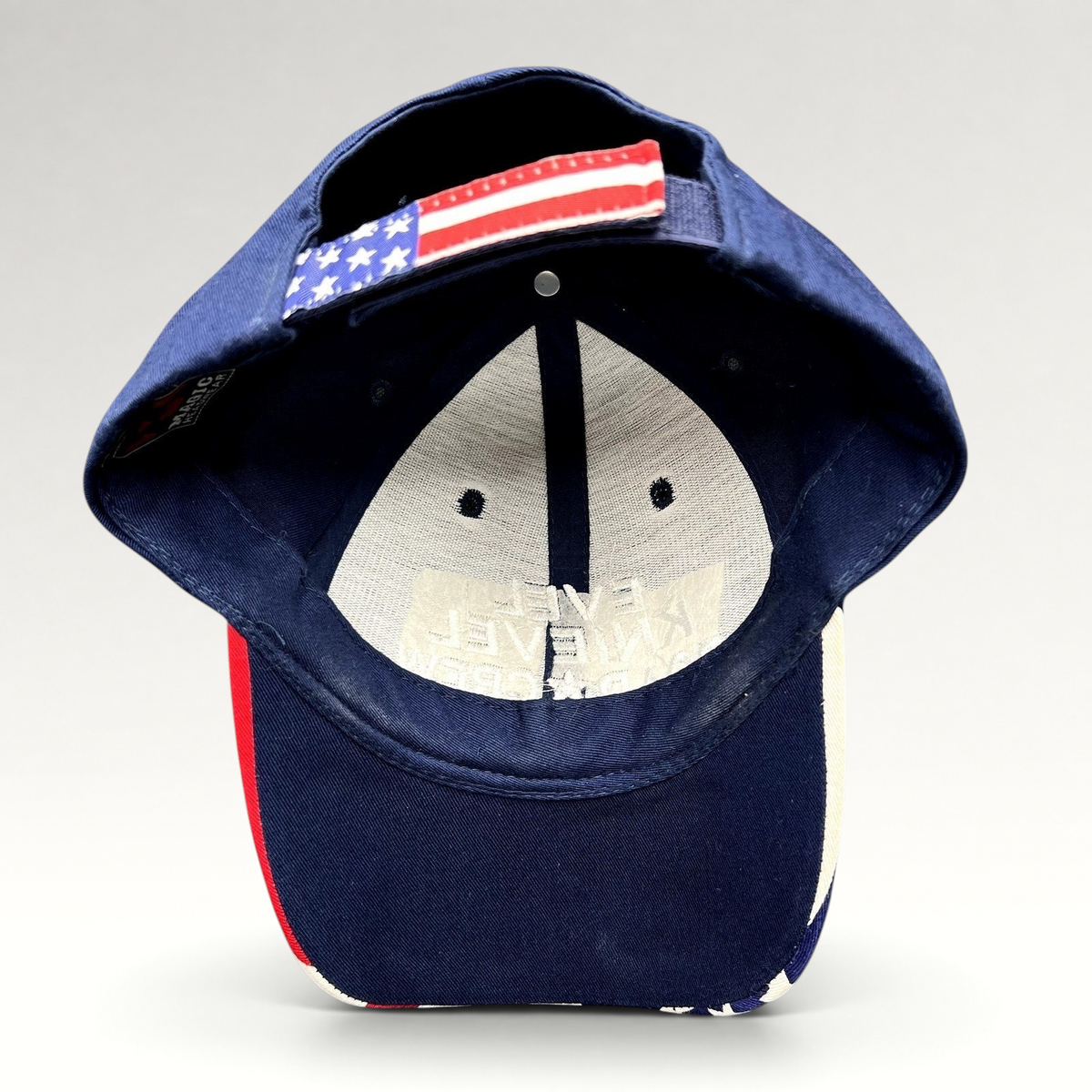 Raree Finds Y2K Evel Knievel strapback hat with navy crown and American flag print adjustable hook-and-loop strap