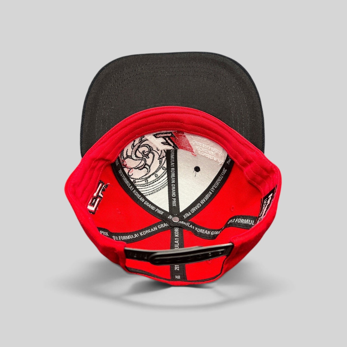 Raree Finds 2013 Formula 1 Korean Grand Prix snapback hat interior showing branded taping and red cotton construction.