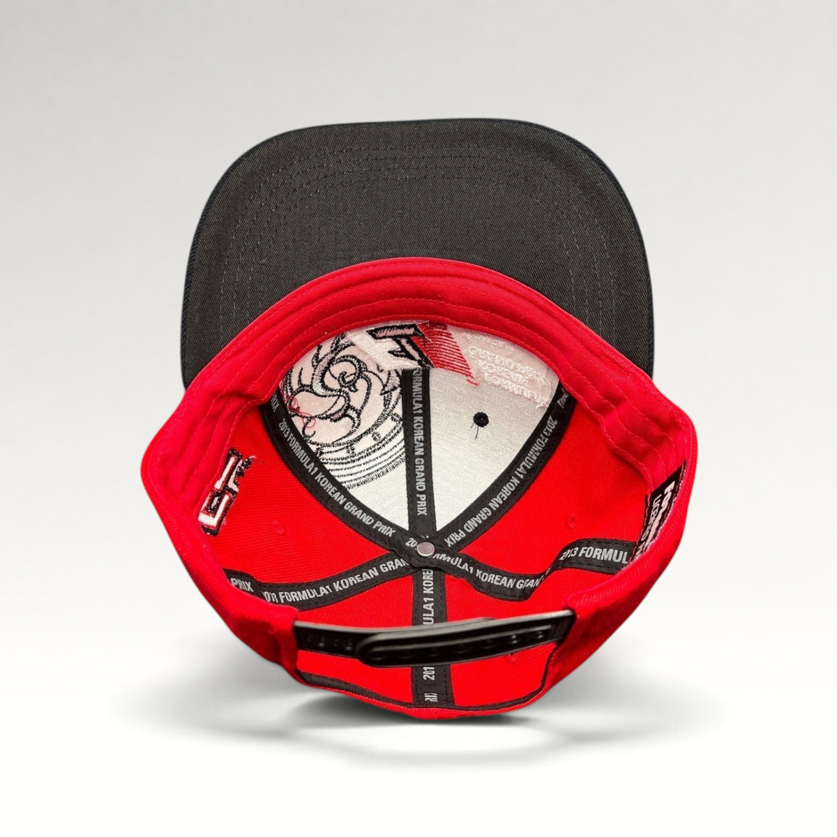 Raree Finds 2013 Formula 1 Korean Grand Prix snapback hat interior showing branded taping and red cotton construction.