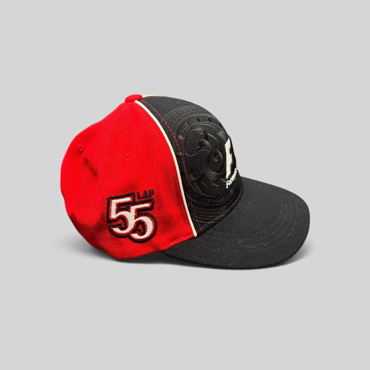 Raree Finds 2013 Formula 1 Korean Grand Prix 1st Place snapback hat in black and red with embroidered 55 lap detail.